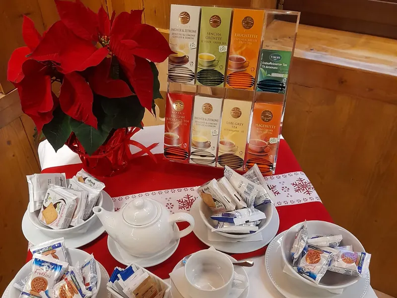 Tea bags, cups and poinsettias for Free Tea Time